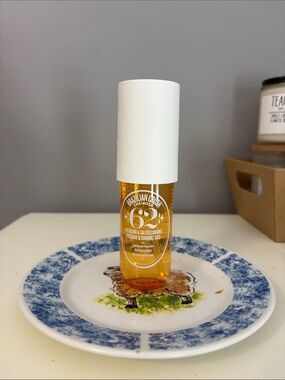 Sol de Janeiro Face Oil & Body Serum in White Cap and Amber Bottle